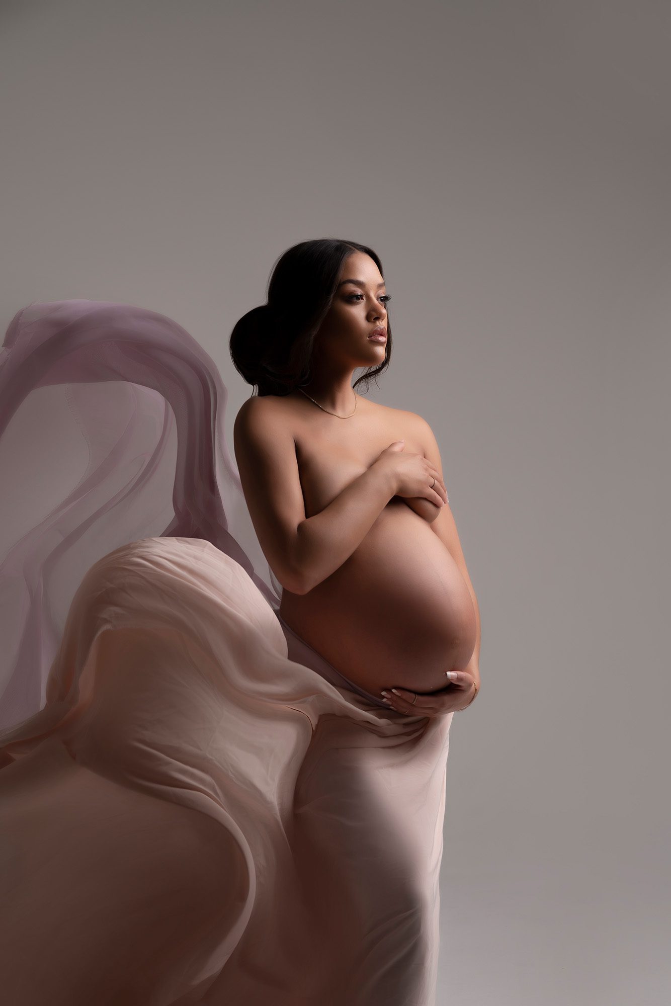 studio maternity session with flowing fabric in Orlando